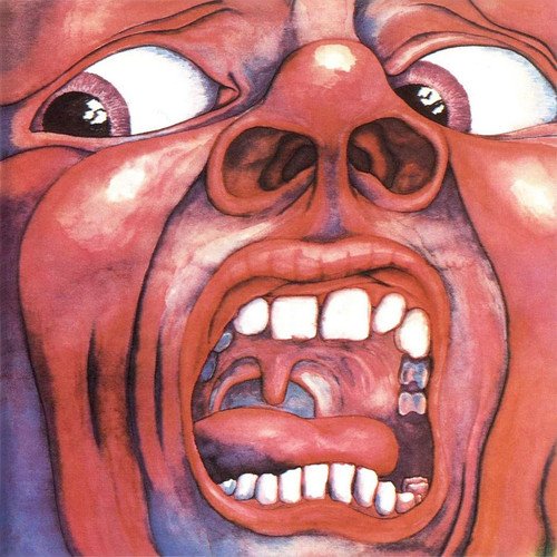 "Album cover art featuring a distorted, screaming face with wide eyes and open mouth."