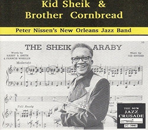 Album cover with black-and-white photo of man playing clarinet on sheet music background.