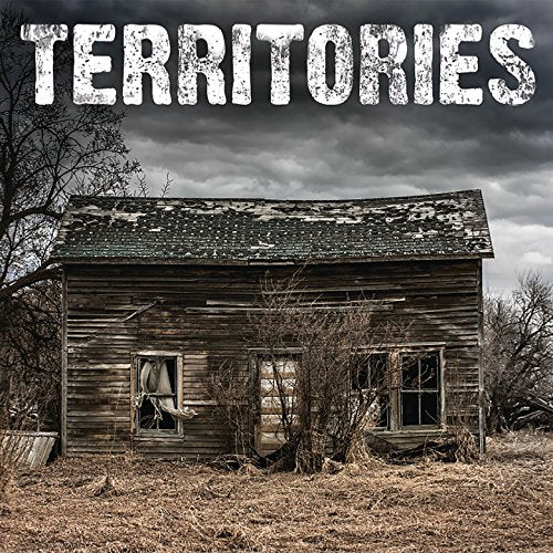 Album cover for “Territories” featuring a dilapidated wooden building.
