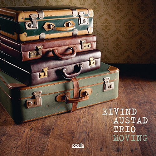 Stack of vintage suitcases with album title "Eivind Austad Trio - Moving".