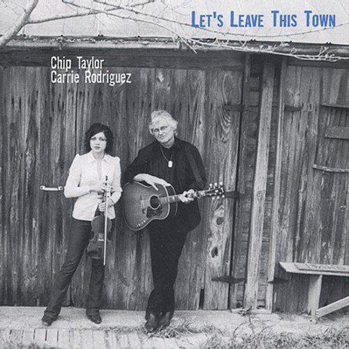 Black and white photo of Chip Taylor and Carrie Rodriguez with a guitar.