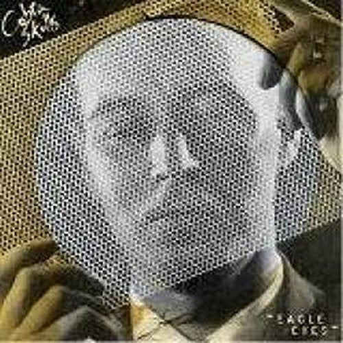 Record cover featuring a person wearing a wire mesh mask.