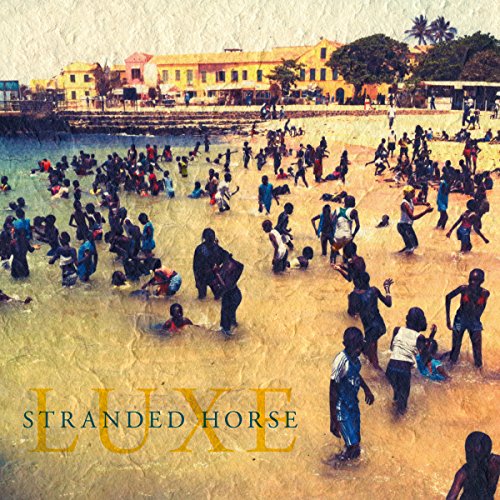 "Album cover with 'Stranded Horse Luxe' text, showing a crowd on a beach."