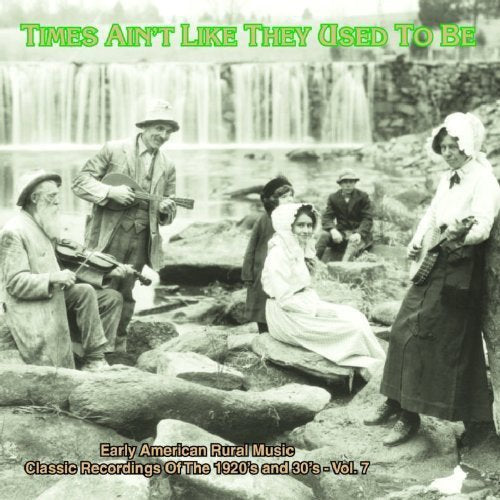 "CD cover with black and white image of people playing instruments outdoors."