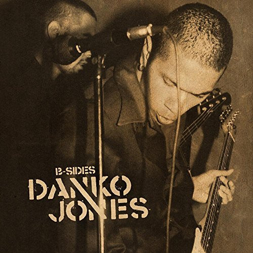 Sepia-toned album cover featuring Danko Jones with a guitar and microphone.