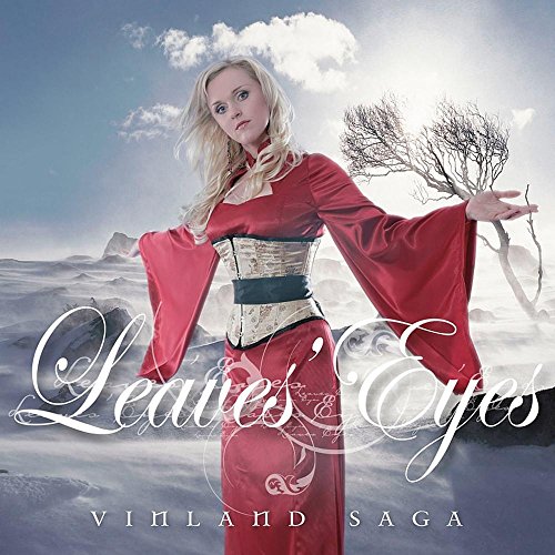 "Album cover featuring a blonde woman in a pink dress against a snowy landscape."
