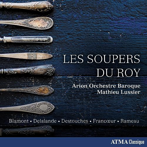 CD cover with antique silver cutlery on a dark blue wood background.