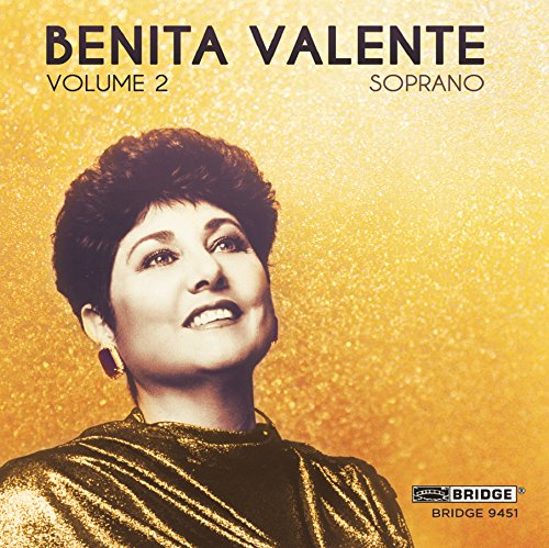 CD cover featuring a woman in gold against a golden background.