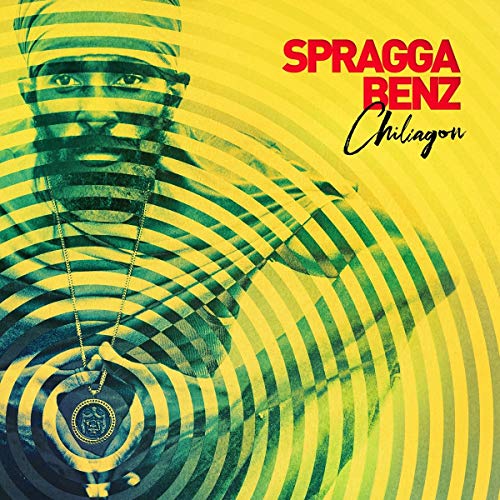 Album cover with a man wearing a head wrap and pendant on a yellow background.
