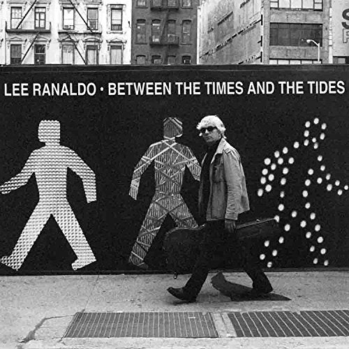 "Black-and-white album cover with man walking dog, abstract figures on wall, cityscape above."