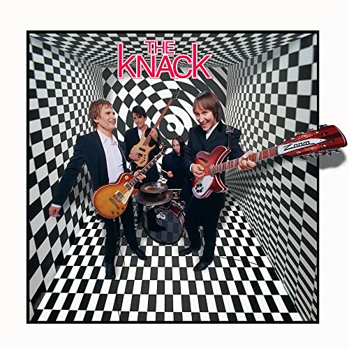 The Knack band portrait within a black and white checkered tunnel.