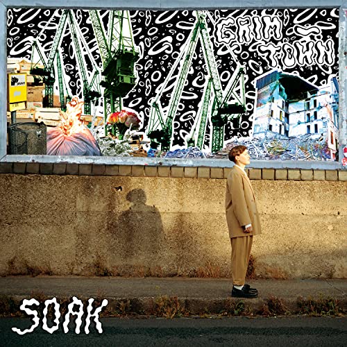 CD cover: boy in suit views industrial landscape with graffiti.