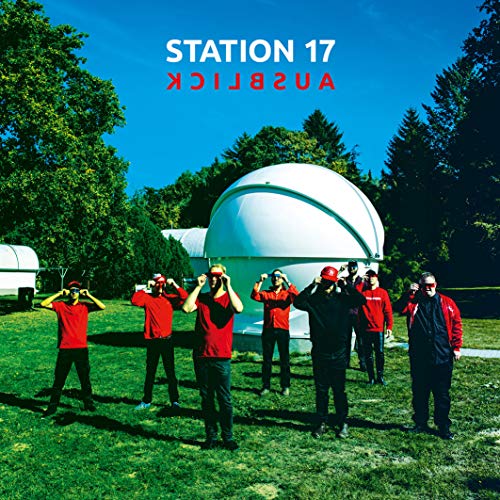 CD cover: people looking at an observatory under a blue sky.
