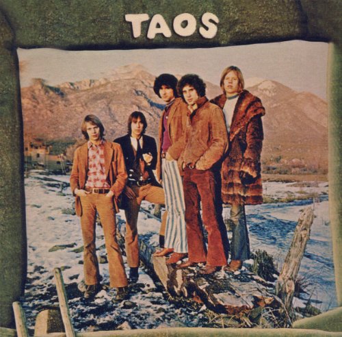 Album cover for “Taos” featuring a band in front of mountains.