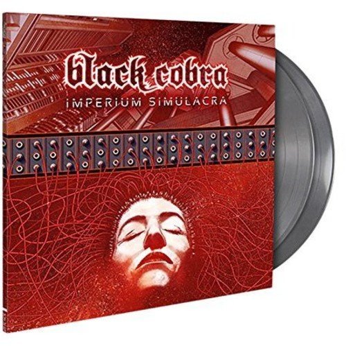 Silver vinyl record with red album cover, featuring a face and machinery.