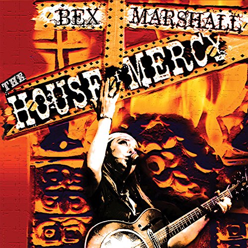 Album cover: man playing guitar, arm raised, against a red and orange background.