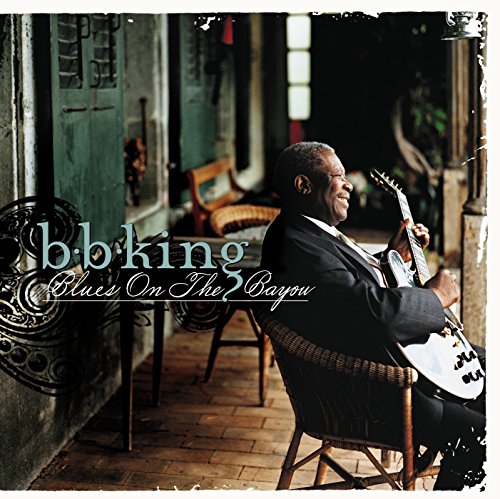 B.B. King seated with a guitar on a porch, album cover.