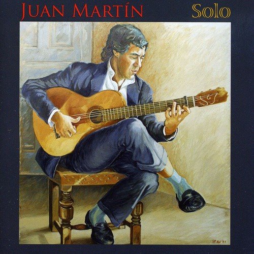 Album cover featuring a man playing guitar, surrounded by dark grey border.