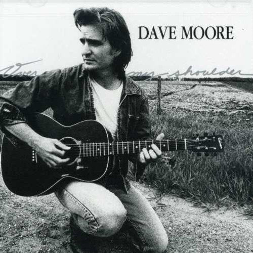Black and white album cover featuring a man kneeling with an acoustic guitar.