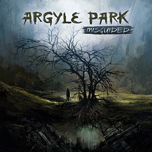 Album cover: desolate landscape with a bare tree and lone figure.