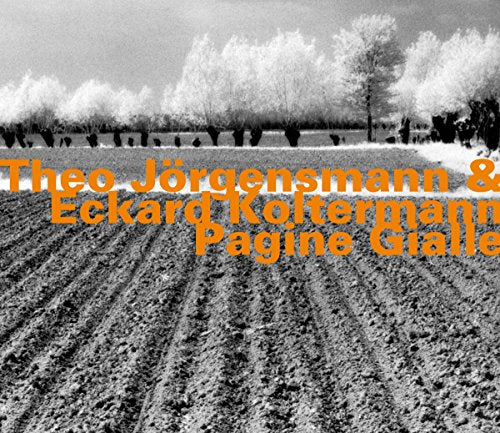 "Black and white photo of a plowed field with orange text overlay."