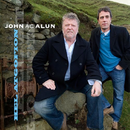 CD cover featuring two men in coats, standing by a stone wall.