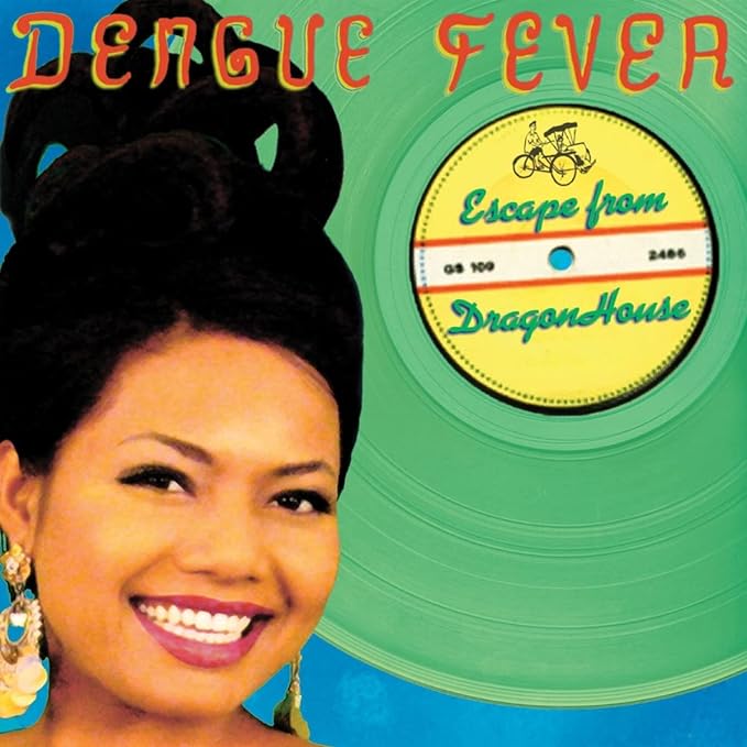 Vinyl record cover featuring a smiling woman and green background.