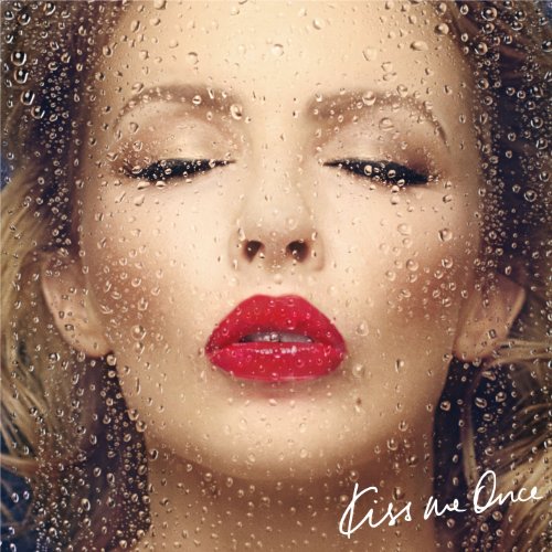 Kylie Minogue's album cover: a woman's face behind a wet glass with "Kiss Me Once" text.
