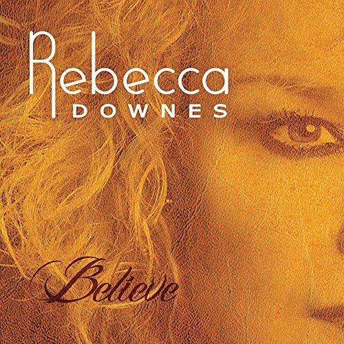 CD cover for Rebecca Downes’ “Believe” featuring a close-up portrait.