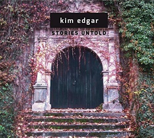 "CD cover with dark arched doorway surrounded by vines and autumn leaves."