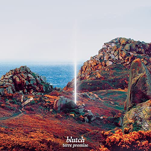 Blutch album cover: rocky coastline with bright light beam and text.
