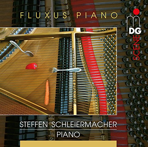 "CD cover featuring an open piano with forks, spoon, and carrot inside."