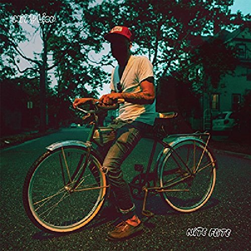 "Album cover art: man on bicycle, shadowed face, red cap, trees and houses in background."
