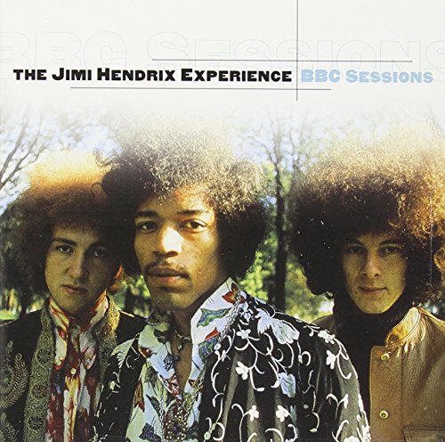 "Album cover featuring three men with afro hairstyles in a wooded background."