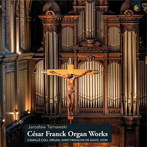 CD cover: ornate organ pipes framing a crucifix in a church.