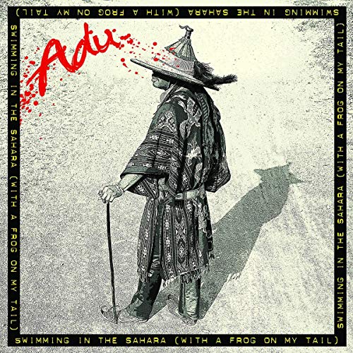 CD cover: Man in patterned robe and hat, seen from behind.