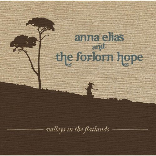 "Album cover with silhouette of a person and trees on a hill."