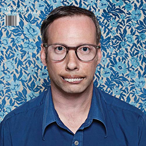Vinyl album cover for Tortoiseās āCatastrophistā featuring a man with glasses.