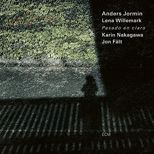 CD cover: green foliage over dark, textured ground with text.