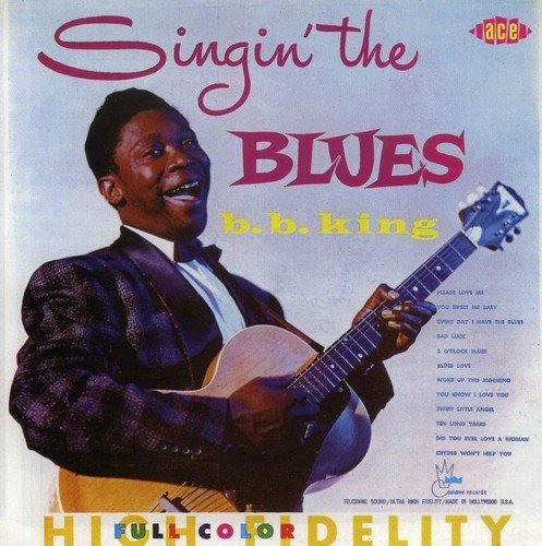 B.B. King album cover featuring a man holding a guitar, smiling, with colorful text overlay.