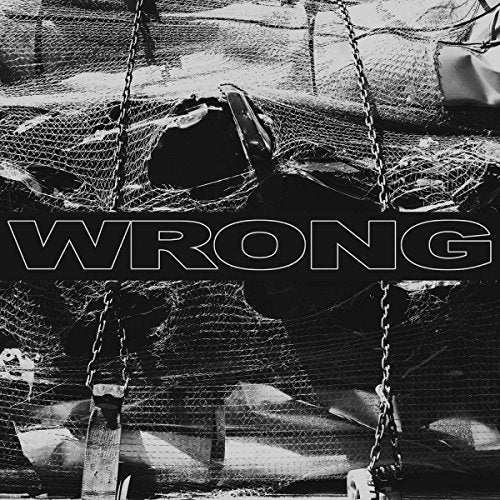 "Black and white album cover with 'WRONG' text and industrial scene."
