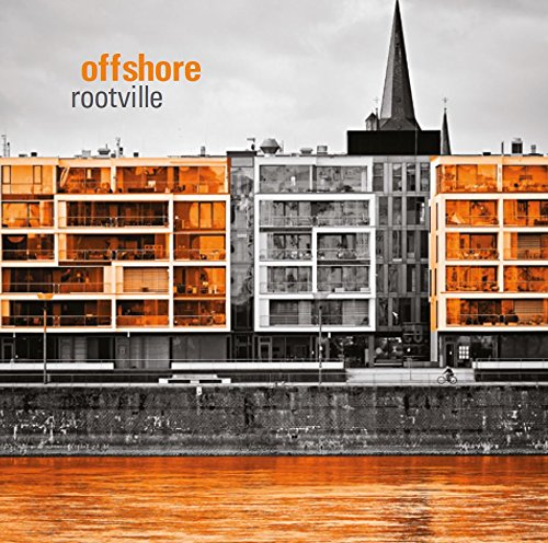 "Album cover featuring a multi-story building with a church steeple behind it."