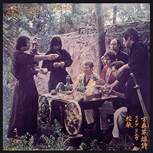 CD cover: group around a table in a forest setting.