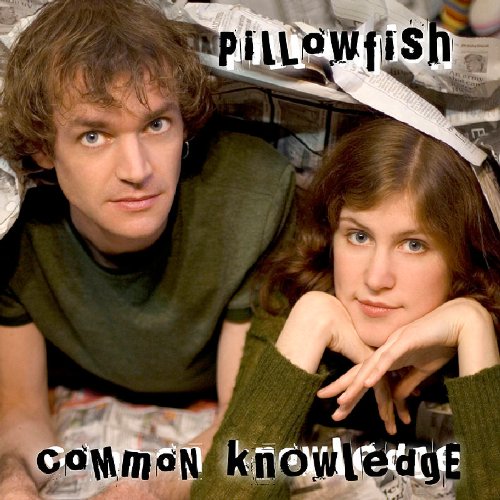 "Album cover featuring a man and woman lying together under crumpled newspaper."