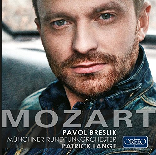 A man with a beard and denim jacket on a CD cover.