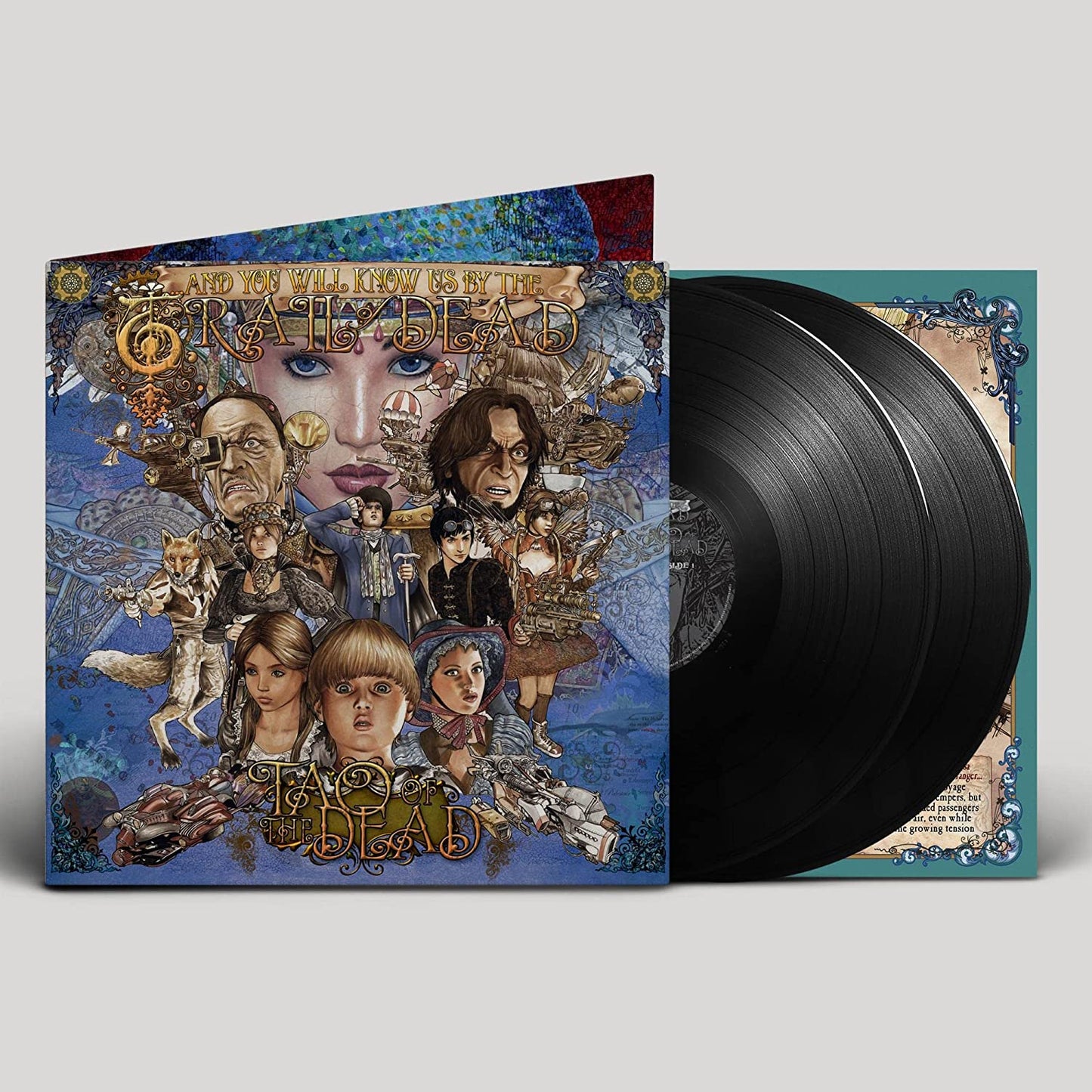 Vinyl record with ornate cover art featuring portraits and floral designs.