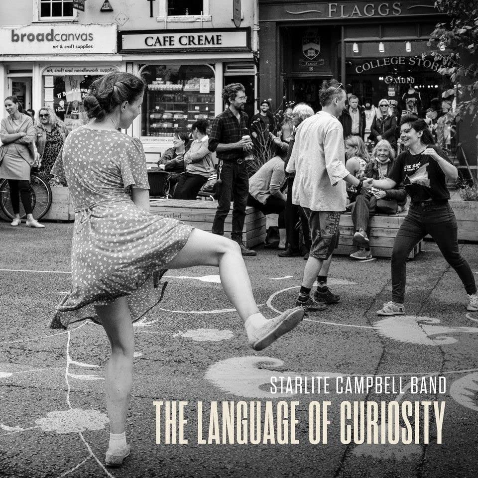 Black and white album cover featuring dancers on a street, band name below.