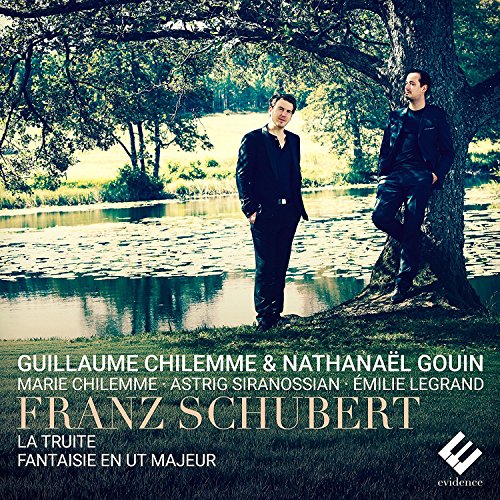 Two men stand by a tree and pond on CD cover art.