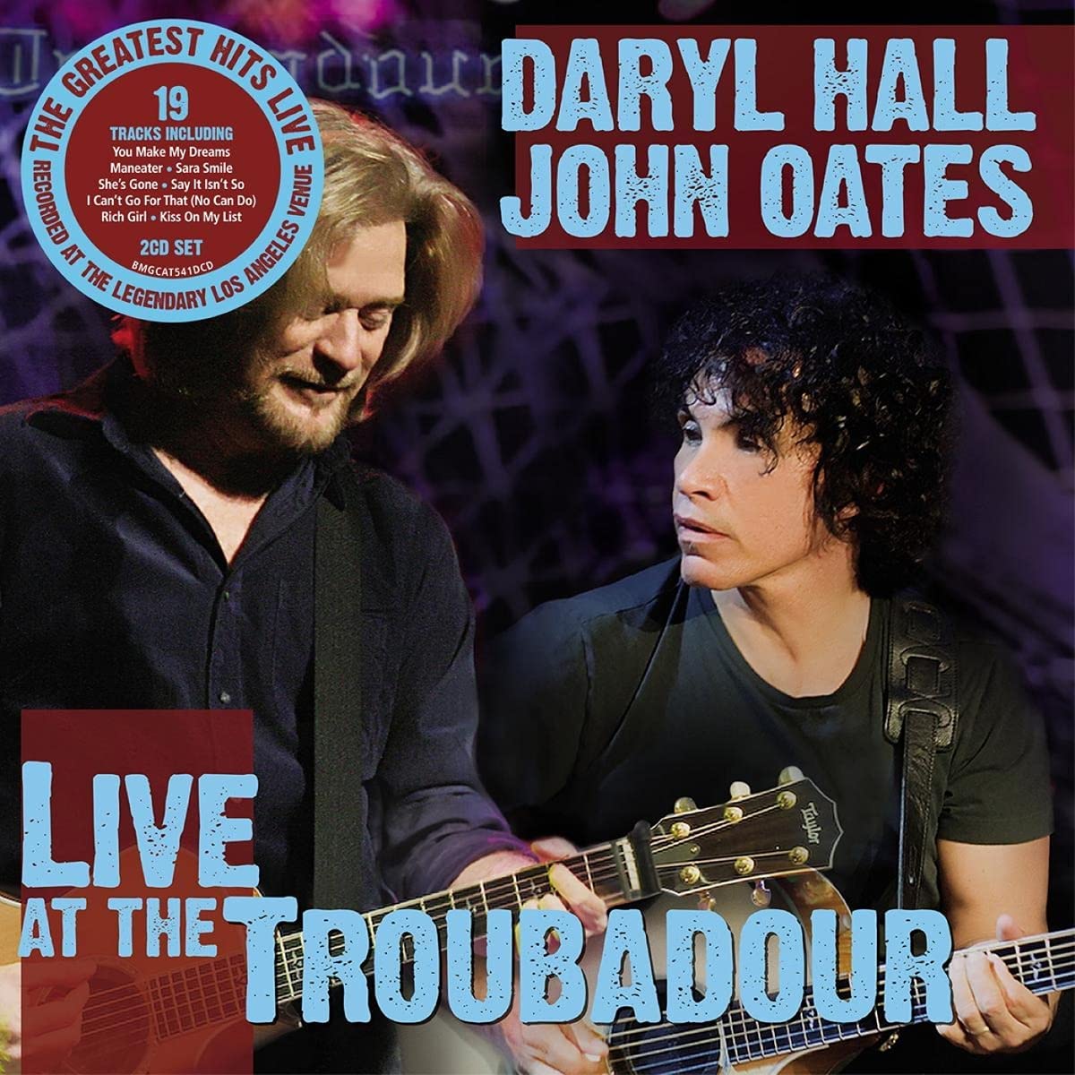 Album cover featuring Daryl Hall and John Oates holding guitars, with text overlay.