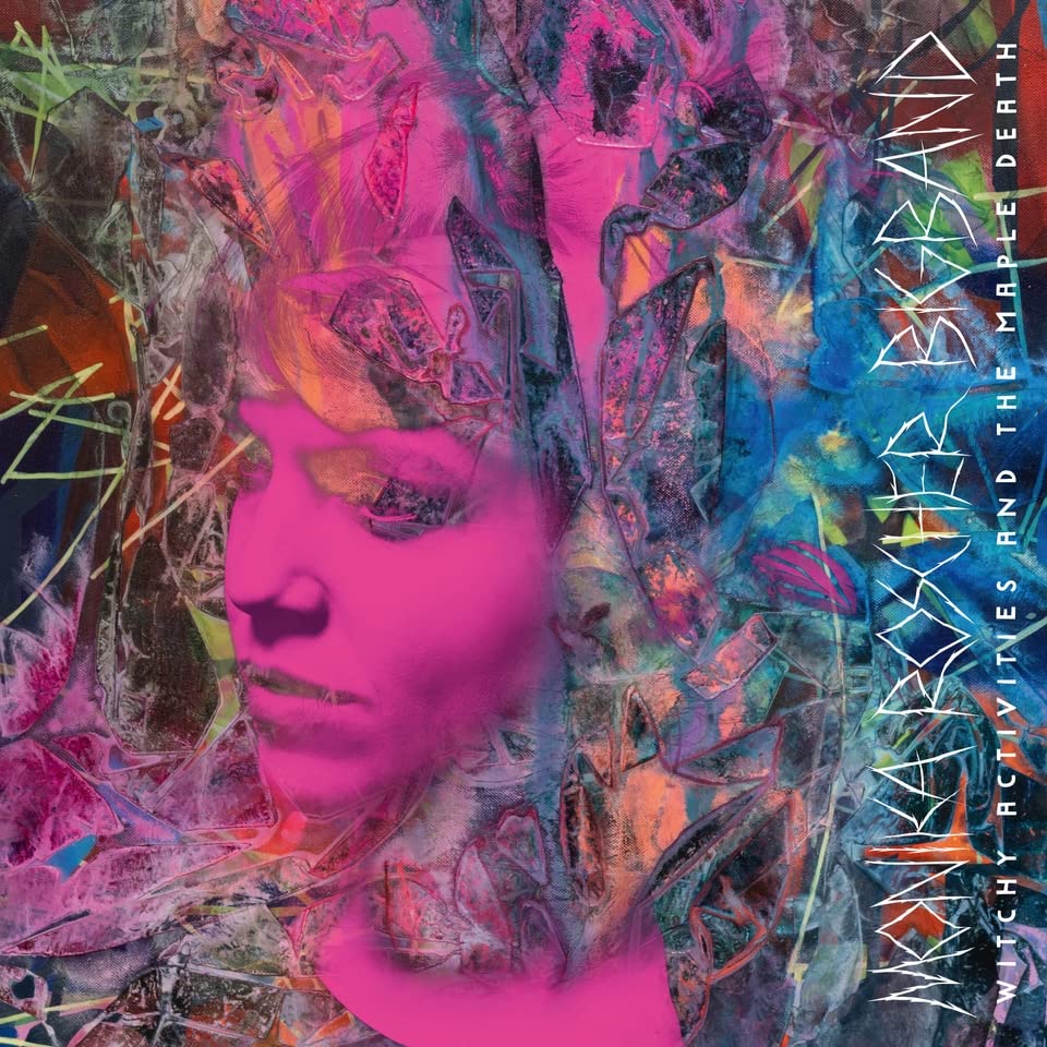 Album cover: pink portrait with abstract colorful paint splatters and text.